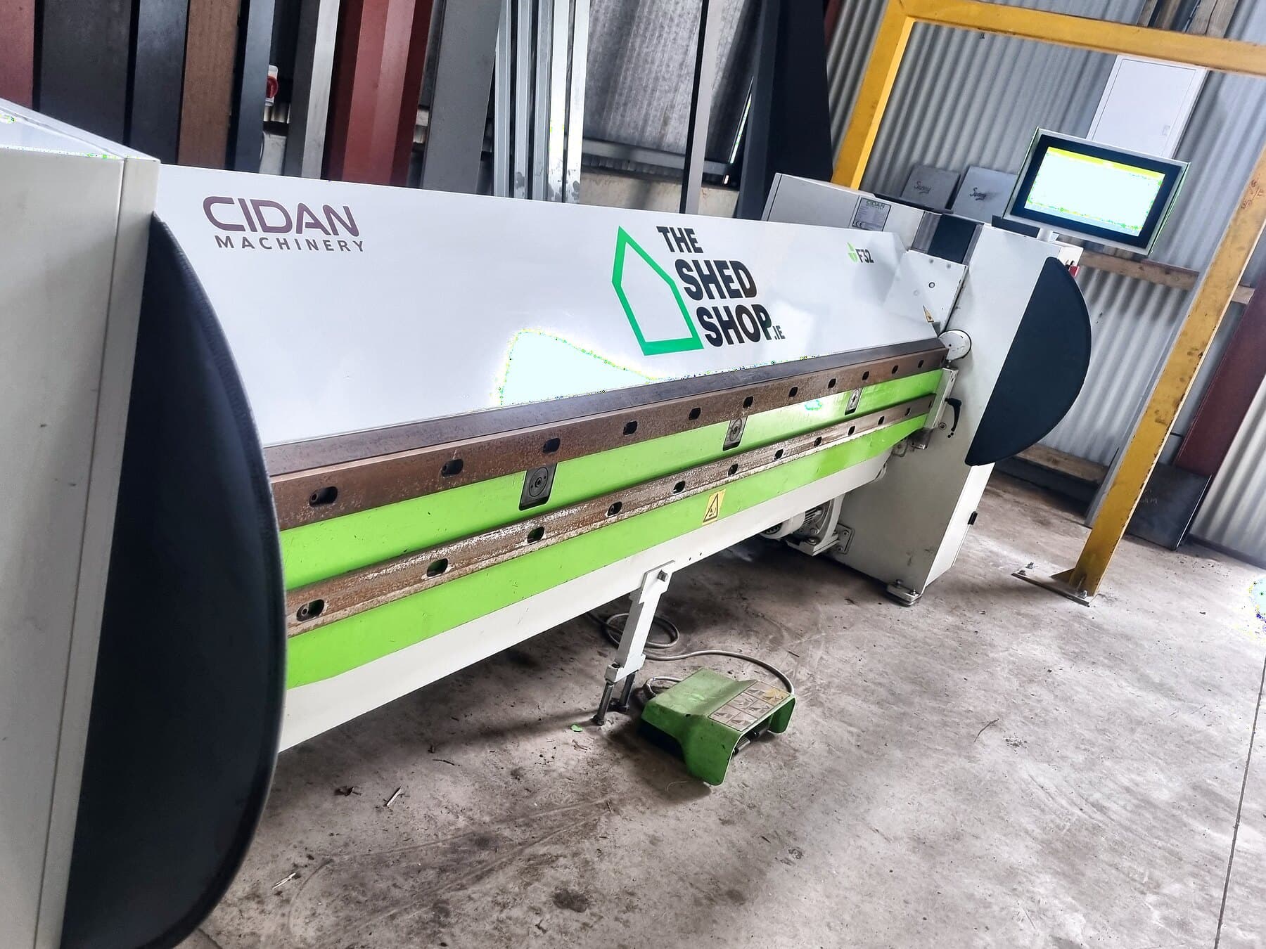 Cidan folding machine in the workshop, carrying the shed shop logo